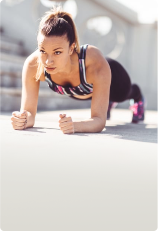 A woman performing a plank exercise as part of her workout routine,