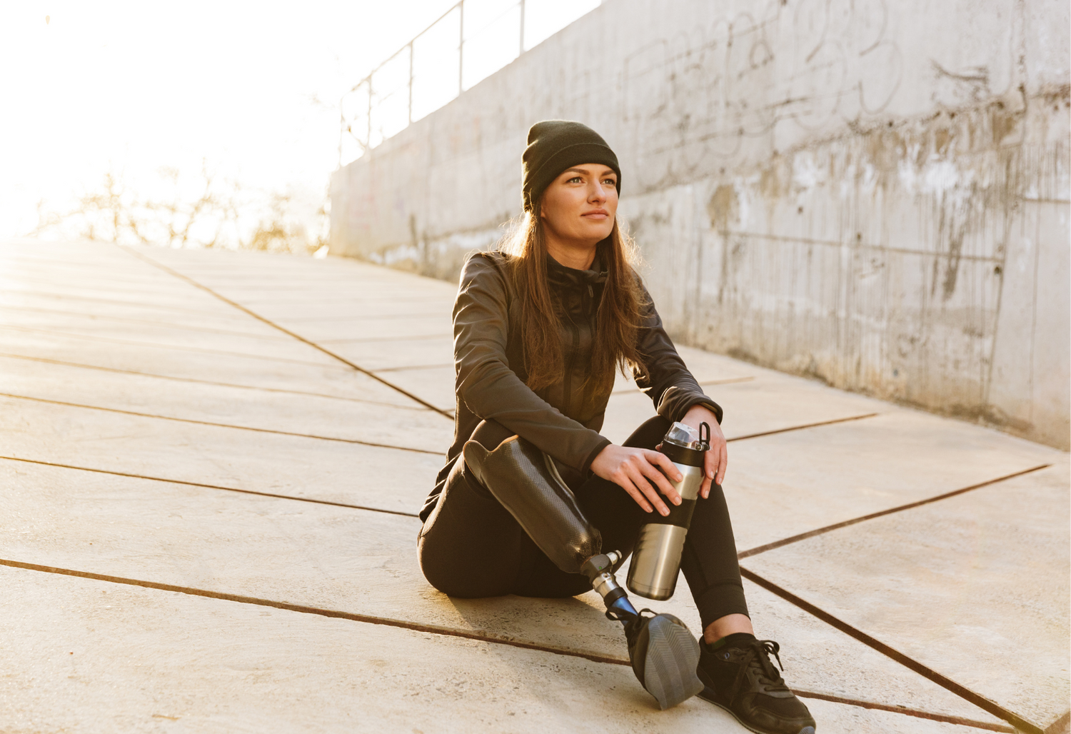 An image of a woman with a prosthetic leg wearing athletic clothing is used to represent Soothe Organic's focus on assisting active individuals achieve a healthy lifestyle.