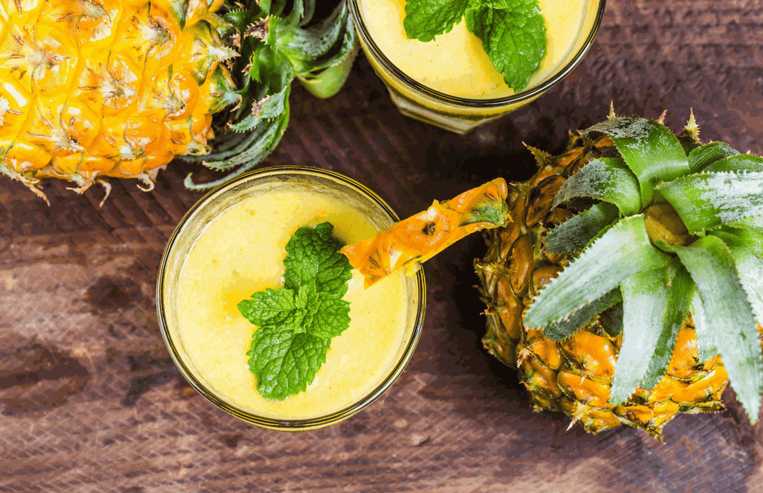Tropical CBD mocktail with fresh mint and lime made with organic CBD tincture for natural relaxation