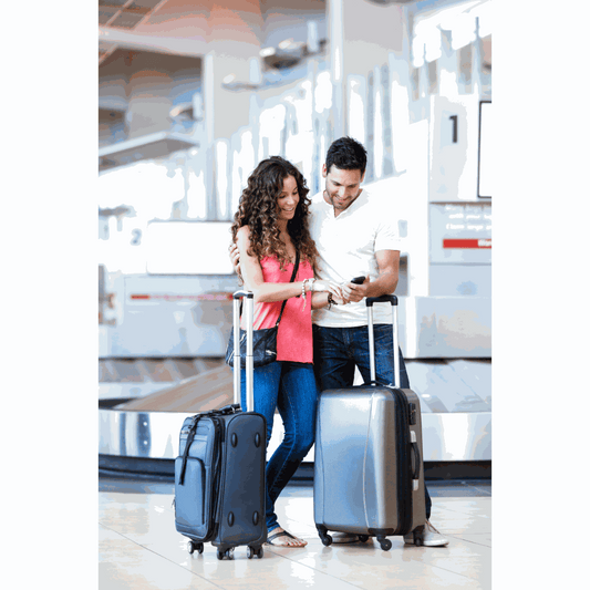 Woman packing CBD softgels into a carry-on suitcase open on a bed, passport and boarding pass visible on the nightstand