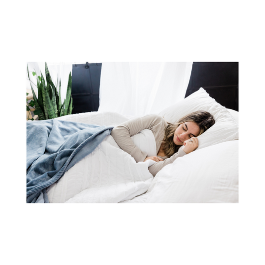 oothe Organic Delta-9 THC gummies in pineapple, blueberry lemonade, and orange flavors arranged on a wooden bedside table next to a soft nightstand lamp.