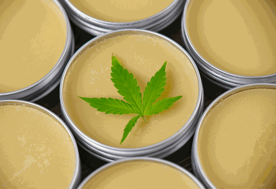 Athlete applying Soothe Organic USDA Certified Organic topical CBD salve to knee after workout for targeted muscle recovery