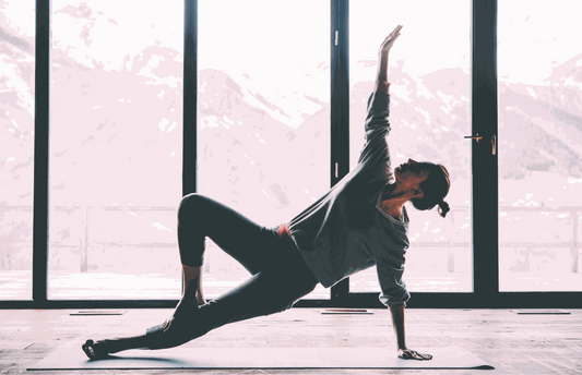 Hands holding a Soothe Organic Broad-Spectrum CBD tincture at a sunrise kitchen window in Casper, Wyoming, representing small daily wellness habits with USDA Certified Organic CBD