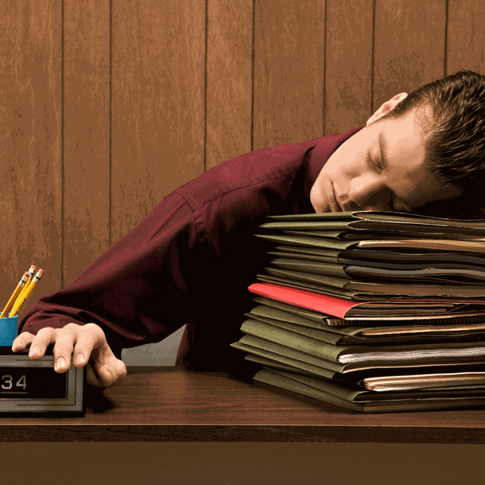 A woman in her 40s sleeping deeply in a dark, calm bedroom, representing the restorative power of quality sleep for brain health