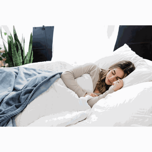 "A calm overhead photo of a Soothe Organic Sleep Softgel bottle and a single softgel resting on an open sleep journal beside a small linen pouch and a cup of chamomile tea — soft natural light, restful color palette.
